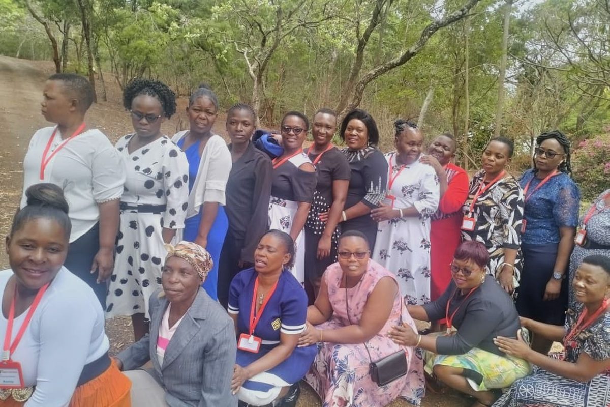 Women of Great Potential Ladies posing together among the trees